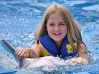 Keira with dolphin